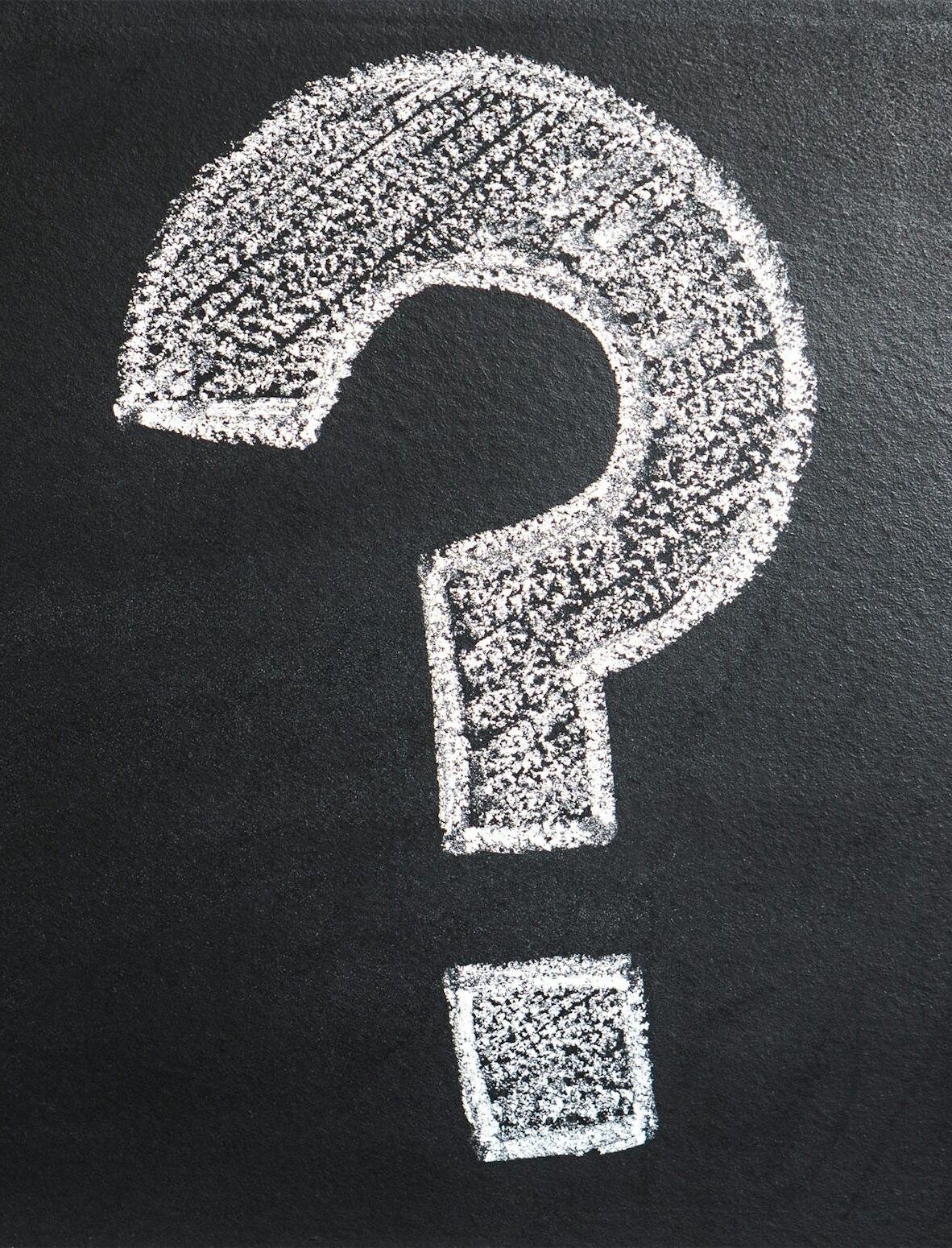 A conceptual image featuring a question mark drawn on a chalkboard, ideal for problem-solving contexts.